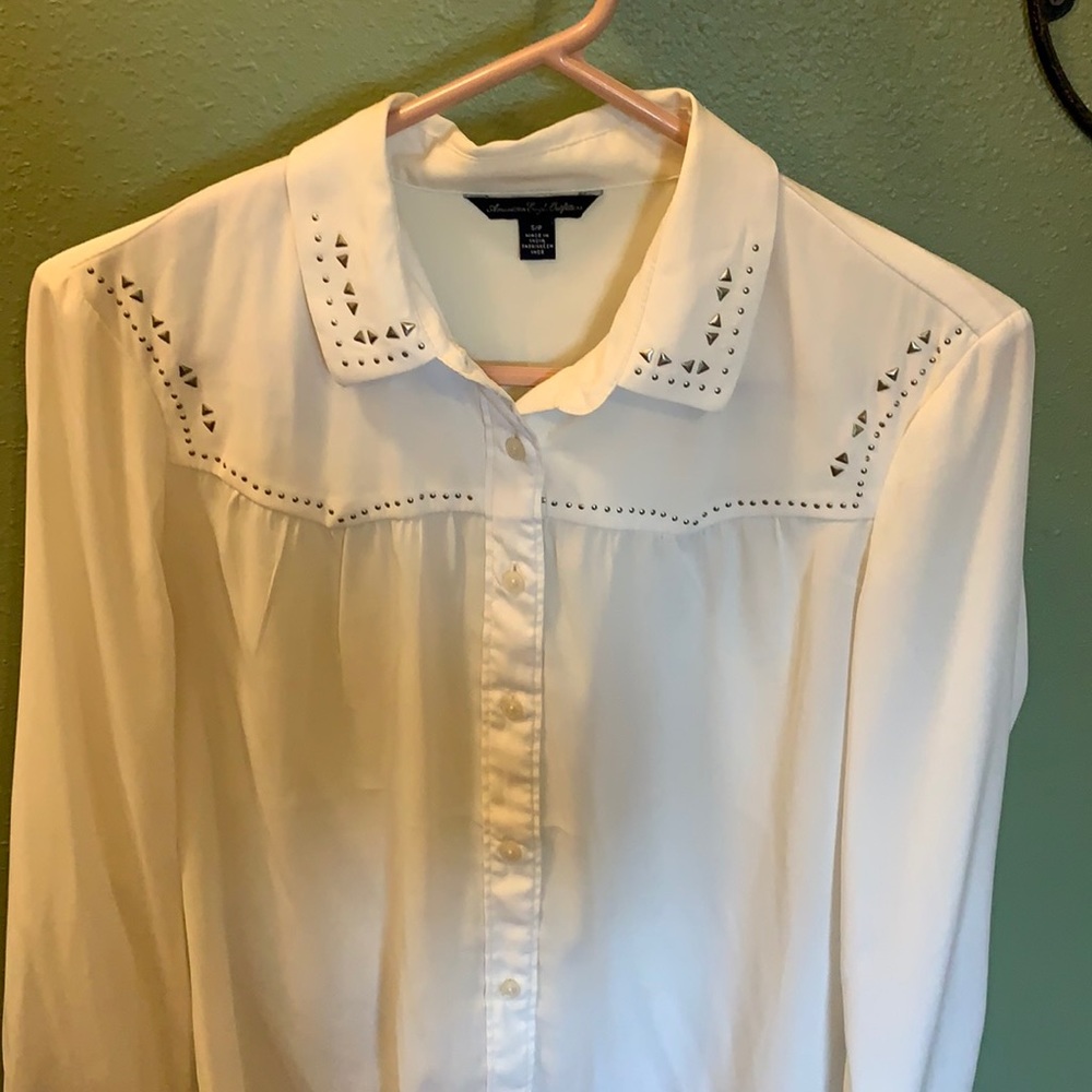 Cream colored blouse, with rhinestone decor!